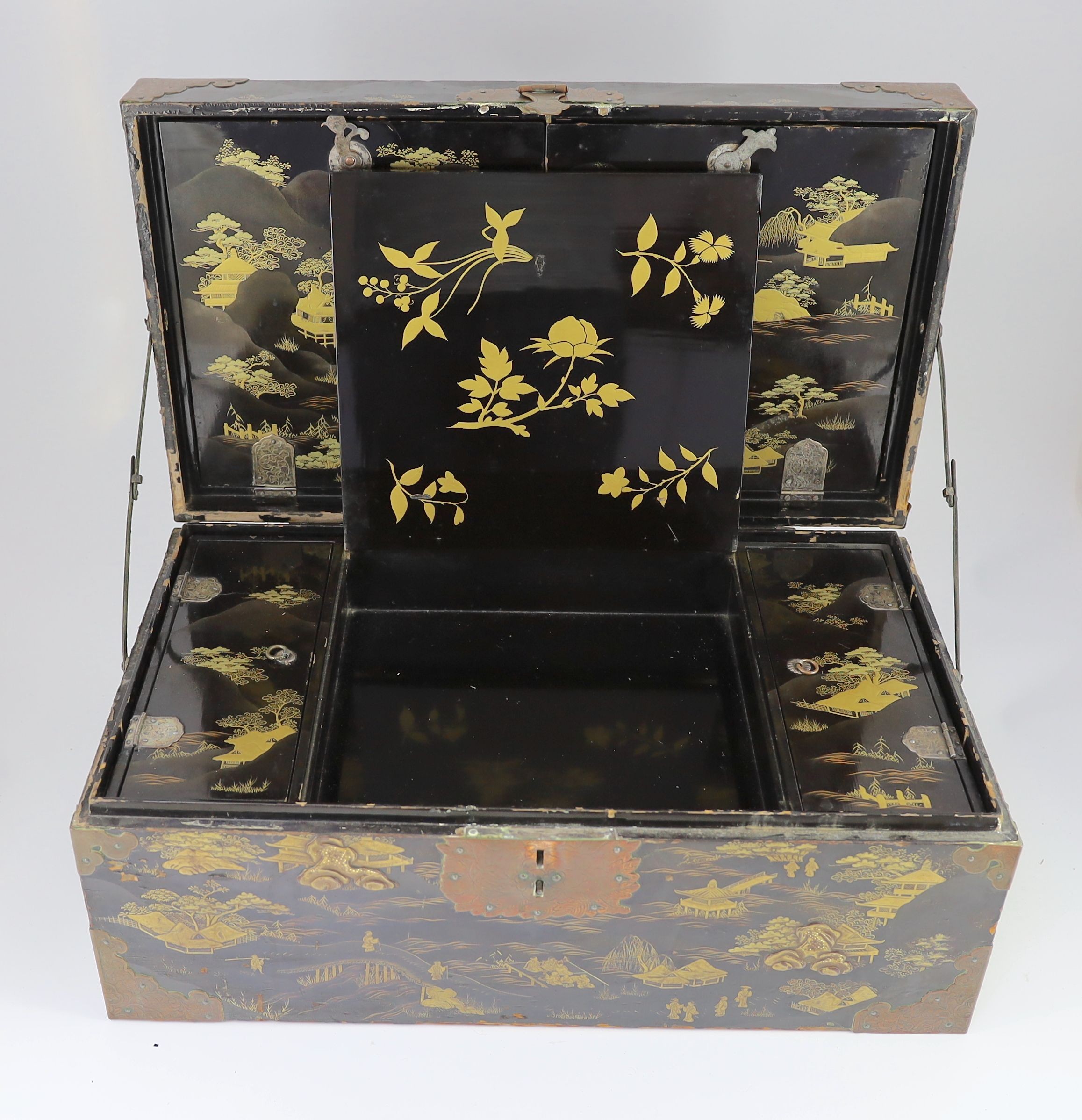 A Japanese lacquer fitted travelling trunk, 19th century, 55cm wide, H 23cm. D 32cm. Some losses to lacquer and wear to mounts